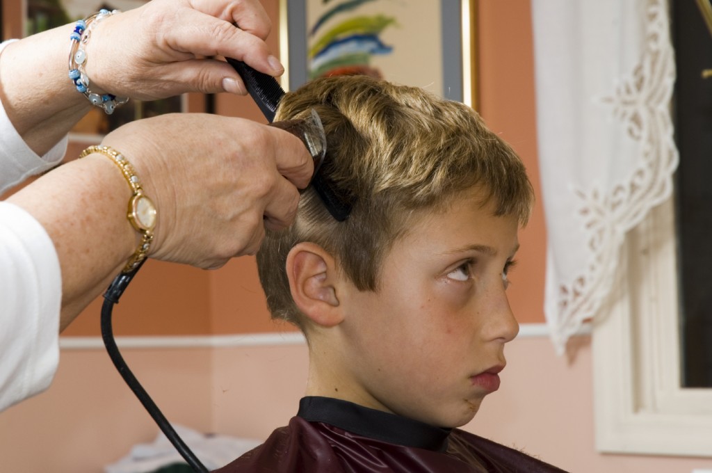 Young boy at barber shop