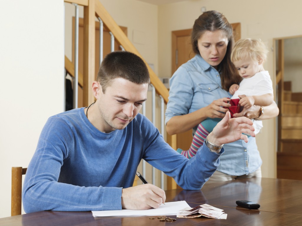 Family with baby having quarrel quarrel over money