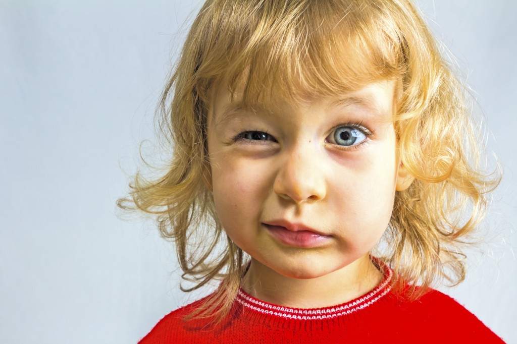 Blue-eyed, 3 year old girl in red dress