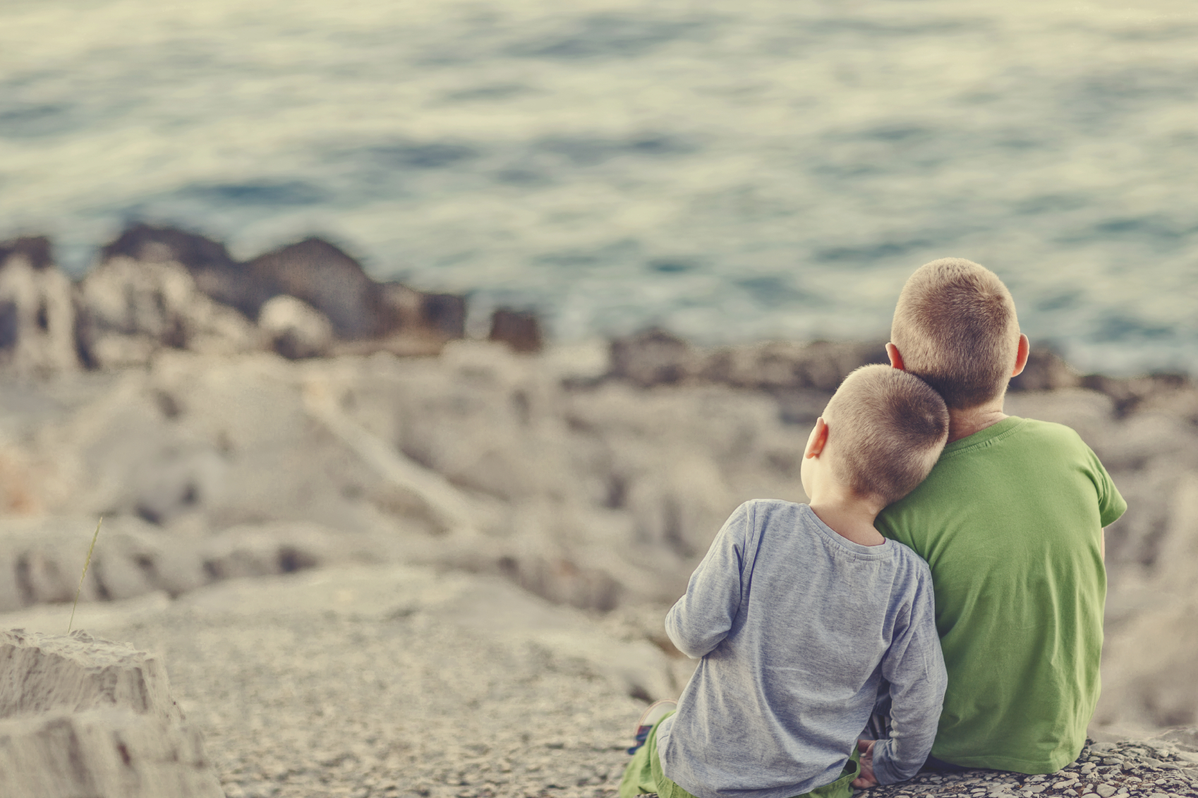 Kind c. Kindness. Kindness to parents Islamic. =A boy sitting and watching the Sea.