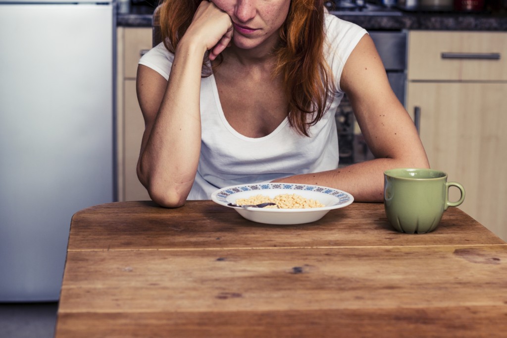 Woman doesn't want to eat her cereal