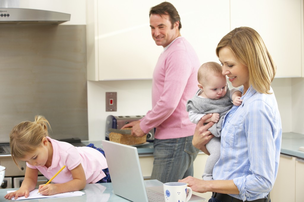 Family busy together in kitchen