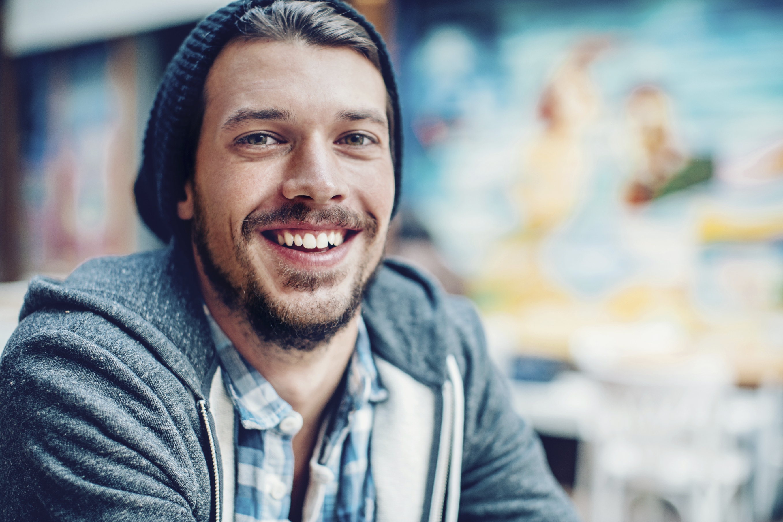 Portrait of smiling young man with copy space outdoors