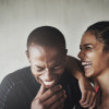 Shot of a sporty young couple laughing