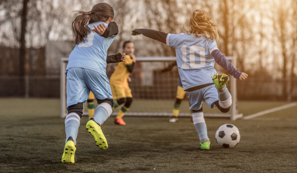 girls-playing-soccer-e1552659726468